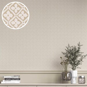 May include: Beige wallpaper with a subtle geometric pattern, featuring a close-up of a floral design. The wall is decorated with a shelf holding books and decorative vases with plants. The overall aesthetic is neutral and modern.