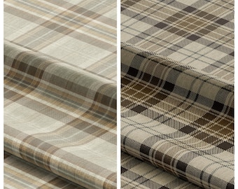 May include: Two fabric samples with plaid patterns. The left sample, labeled "FLORIDA MAT", features a beige and brown plaid. The right sample, labeled "GALLON HAT", displays a darker brown and beige plaid design. Both fabrics are folded.