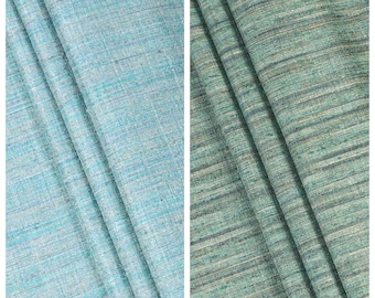 May include: Two fabric samples, one in "Morning Aqua" and the other in "Electric Grass." The "Morning Aqua" fabric is a light blue-green with a subtle texture. The "Electric Grass" fabric is a darker green with horizontal stripes.