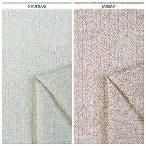 May include: Two fabric swatches with a chevron pattern. The swatch on the left is a light blue color with the word "NAUTILUS" printed above it. The swatch on the right is a light brown color with the word "JARRAH" printed above it.