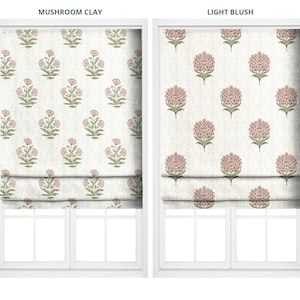 May include: Two window treatments with floral patterns. The left one is labeled "Mushroom Clay" and features a repeating design of pink flowers with green leaves on a cream background. The right one, "Light Blush," has a similar pattern.