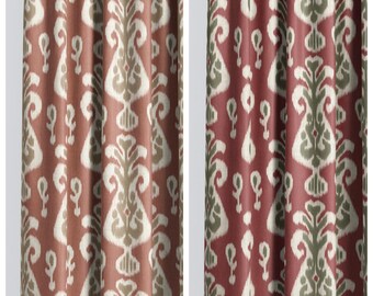 May include: Two patterned curtain panels. The left panel, labelled "GRENADINE PATCH", has a repeating design in red, beige, and white. The right panel, labelled "YUCCA", has a similar pattern in red, green, and white.