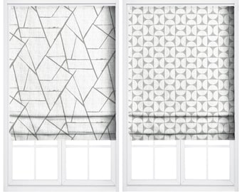 May include: Two window treatments are displayed. The left window treatment is labeled "HARDWICK" and features a white fabric with a gray geometric design. The right window treatment is labeled "HIMALAYAN TREK" and has a white fabric with a gray circular pattern.