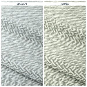 May include: Two fabric swatches with a woven geometric pattern. The swatch on the left is labeled "SEASCAPE" and is a light blue-gray color. The swatch on the right is labeled "JOJOBA" and is a light olive green color.