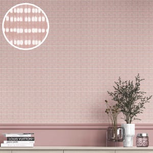 May include: A close-up of a pink and white textured wallpaper with a grid pattern. The wallpaper has a subtle, horizontal stripe design. The image also shows a shelf with decorative items, including books, plants, and a glass jar.