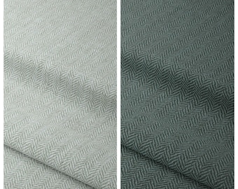 May include: Two fabric swatches featuring a classic herringbone pattern. The left swatch is labeled EVERFORGE and is light gray, while the right swatch is labeled ROSEMONT and is a deep, dark forest green. Both display a woven texture.