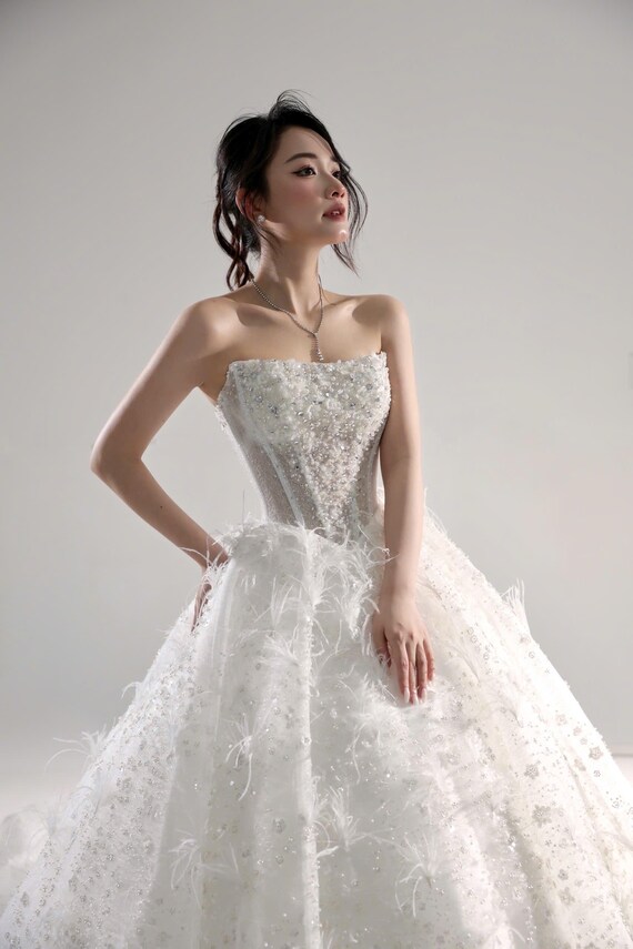 white wedding dress with silver accents Top 8 Elegant and bold Silver Wedding Dresses for Brides