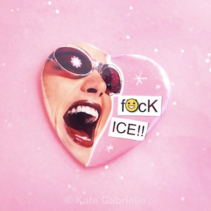 May include: A pink heart-shaped graphic featuring a collage of a face wearing sunglasses and screaming. The heart has the text "f@ck ICE!!" with a smiley face. The background is pink with glitter.