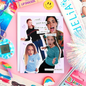 May include: A greeting card with a collage of three women with surprised expressions, the text "i hope your bday is as fun as a Delia's catalog!!" is printed on the card. The card is surrounded by accessories like a lip balm, a smiley face, and a Tamagotchi.