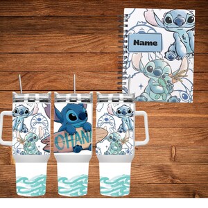 May include: A set of three white tumblers with handles and a matching spiral-bound notebook. Each tumbler features a blue cartoon character design with the word "OHANA" on a surfboard. The notebook has the word "Name" on it.