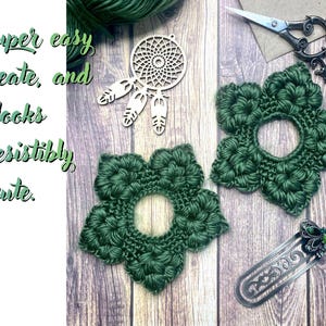 May include: A wooden dreamcatcher, two green crocheted flower shapes, and two silver bookmarks with green butterfly accents are arranged on a wooden surface. The text reads, "It's super easy to create, and looks irresistibly cute."