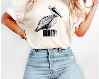 ペリカングラフィックTシャツ、バードラバーシャツ、ネイチャーエンスージアストトップス、カジュアルビーチウェア、ワイルドライフTシャツギフト