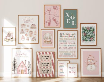 May include: A collection of framed art prints with a winter and Christmas theme. The prints feature illustrations of ice skates, snowmen, snow globes, and holiday phrases in pink, green, and brown tones. The frames are a warm brown color.