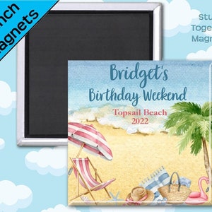 May include: A 2-inch magnet featuring a watercolor illustration of a beach scene with a palm tree, beach umbrella, beach chairs, and a flamingo float. The text "Bridget's Birthday Weekend Topsail Beach 2022" is written on the magnet.