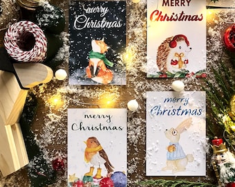 Biglietti di auguri natalizi. Set di 4 biglietti stampabili, raffiguranti una volpe, un riccio, un coniglio e un pettirosso.