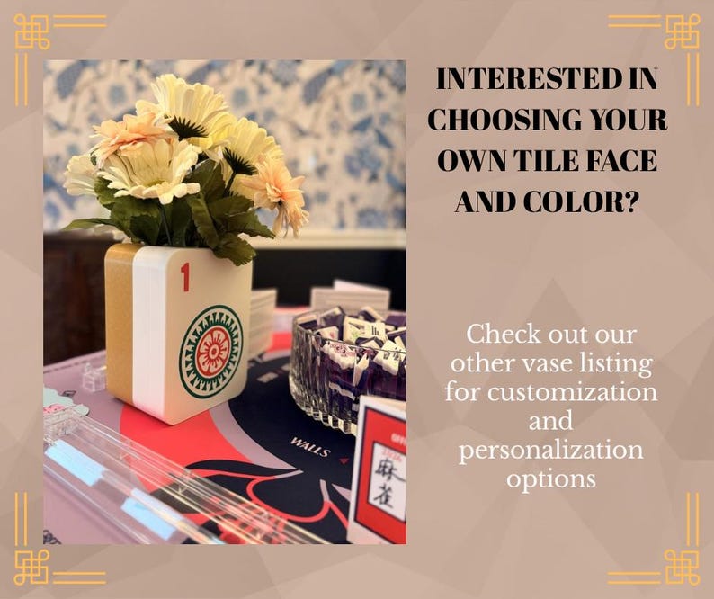 May include: A white and gold vase shaped like a mahjong tile with a red number one and a circular green and red graphic, holding a bouquet of cream-colored flowers. Text reads: INTERESTED IN CHOOSING YOUR OWN TILE FACE AND COLOR? Check out our other vase listing for customization and personalization options.