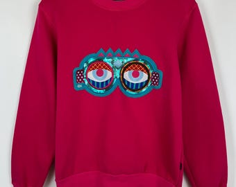 Felpa con paillettes Pink Eyes MCM x Craig & Karl, realizzata a New York, taglia M.