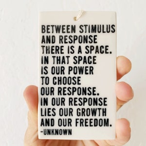 between stimulus and response there is a space... ceramic wall tag • ceramic wall hanging • daily reminder