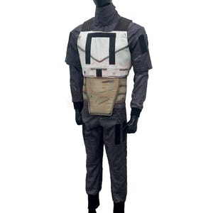 May include: A gray jumpsuit with a white and black chest plate and a tan midsection. The costume includes black gloves and boots. The outfit is designed to resemble a space pilot uniform.