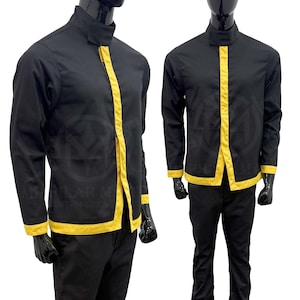 May include: A black long-sleeved shirt with yellow trim around the collar, cuffs, and down the front. The shirt has a mandarin collar and a button closure.