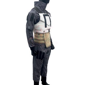 May include: A gray jumpsuit with a white chest plate and a tan belt. The chest plate has a black design. The outfit includes black gloves and boots. The costume is designed for cosplay or themed events.