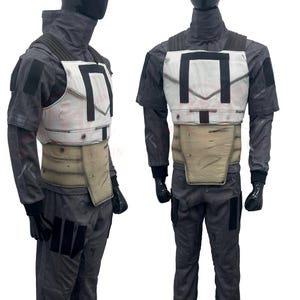 May include: A gray and white costume with a tactical vest and matching pants. The vest is white with black accents and a tan midsection. The outfit includes a high-collared shirt and black gloves. The costume is displayed on a mannequin.
