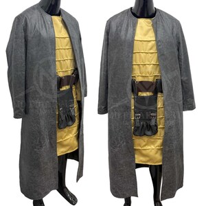 May include: A full-length gray coat with a gold-colored tunic underneath. The tunic has a quilted design. A brown belt with a black pouch is worn around the waist. The coat is open in the front, revealing the tunic and belt.