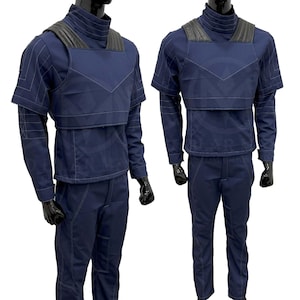 May include: A blue jumpsuit with a black vest and white stitching. The jumpsuit has a high collar and long sleeves.
