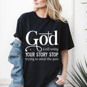 God is Still Writing Your Story Tee - Boho Christian Sweatshirt , Inspirational Bible Verse Shirt, Faith-Based Church Sweater
