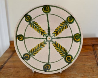 Bulgarian pottery plate fish skeleton green yellow feather arrow motif Balkan pottery handmade at Lacoona