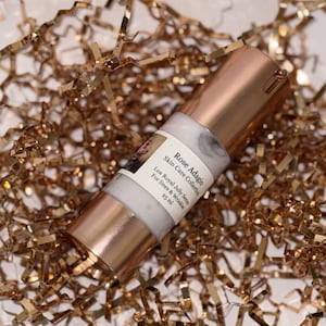 May include: A rose gold bottle of Lux Royal Jelly Serum for lines and wrinkles from the Rose Adagio Skin Care Collection. The bottle is 25 ml.