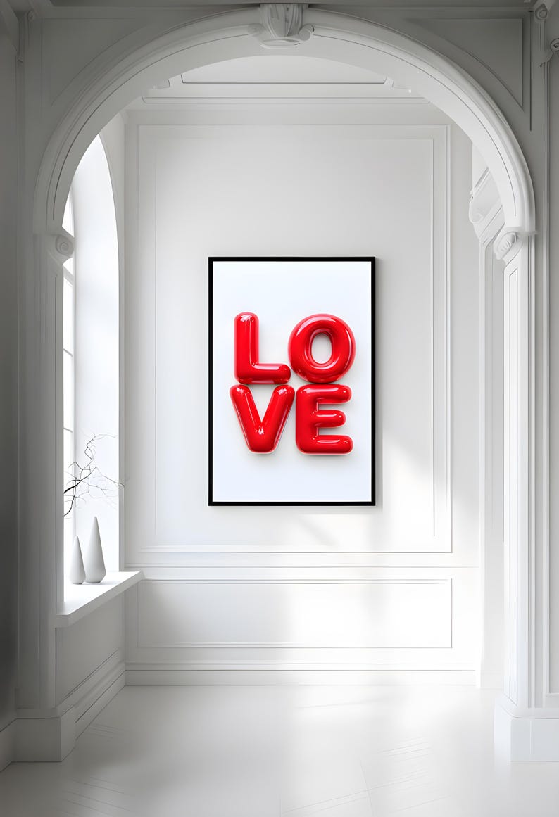 May include: A framed print with the word "LOVE" in large, red, glossy letters against a white background.