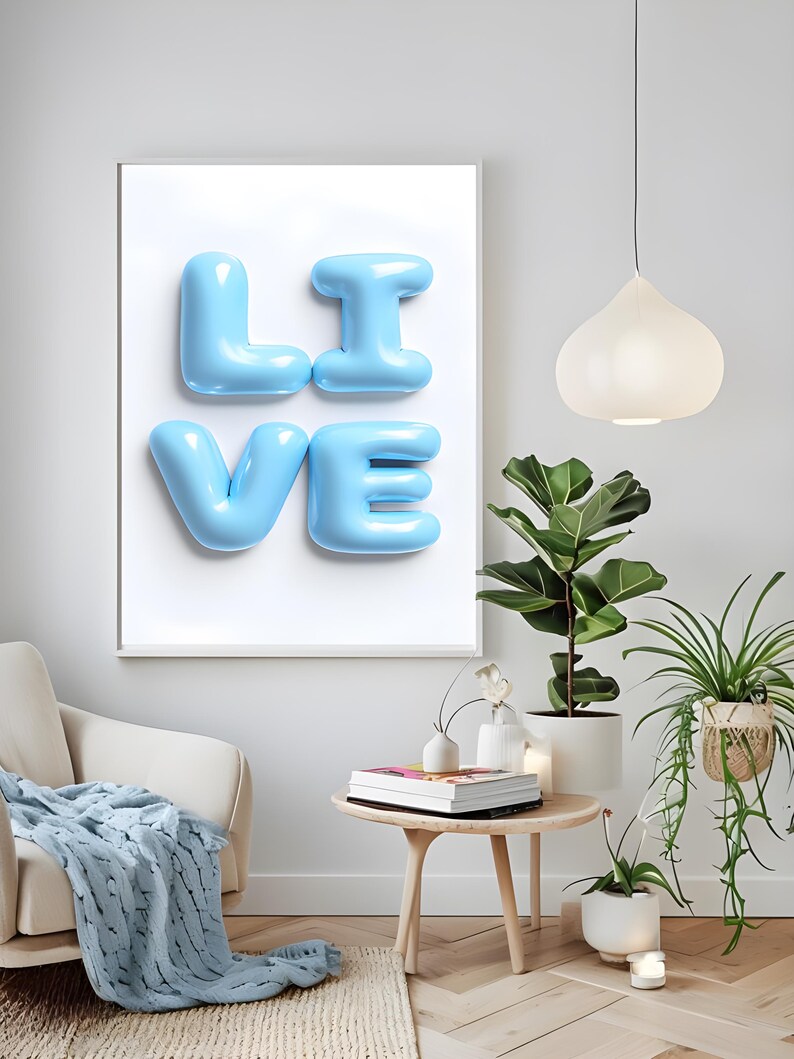 May include: A framed print with the word "LIVE" spelled out in large, light blue, balloon-like letters against a white background.