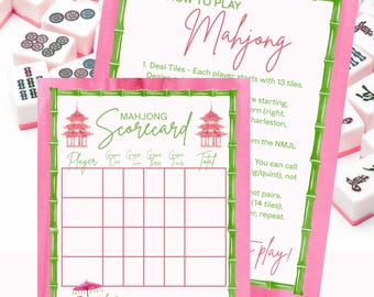 May include: A Mahjong game set with pink and green accents. The image features a "How to Play Mahjong" guide and a Mahjong Scorecard. The scorecard has a pagoda illustration and a monkey with an umbrella. Mahjong tiles are in the background.