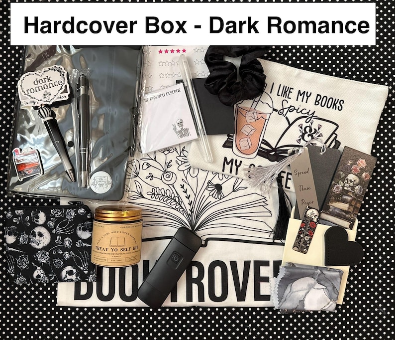 May include: A curated gift box labeled "Hardcover Box - Dark Romance" with various items. Includes pens, a scrunchie, a candle, a pouch with skulls, bookmarks, a tote bag with text, and a black flashlight.