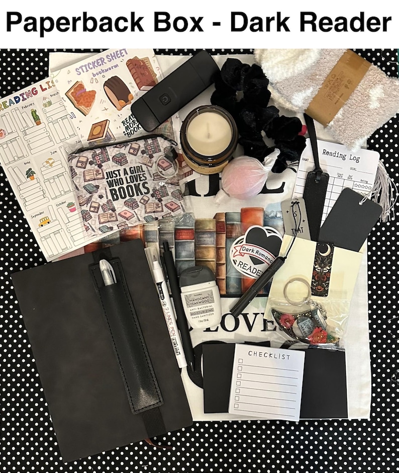 May include: A curated gift box for book lovers, featuring a black journal with pen, candle, stickers, reading log, and other accessories. The box includes a variety of items with a dark romantic theme, perfect for readers.
