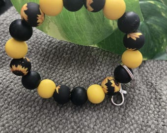 Zwart medium schoudertasje met zonnebloem