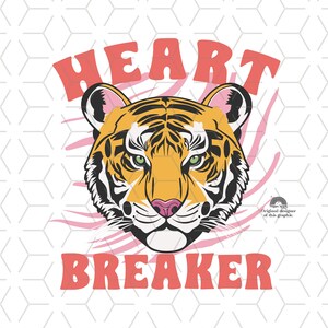 May include: A graphic design featuring a tiger's face with the words "HEART BREAKER" in pink and red letters.