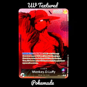 May include: A red trading card with a character from "One Piece". The card has "UV Textured" at the top and "Pokemade" at the bottom. The character is wearing a straw hat. The card has text in English.