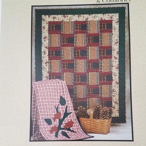 May include: A white ceramic mug with a black handle and the text "But First, Coffee" in a black, bold font. The mug is sitting on a wooden surface. The mug is approximately 4 inches tall.