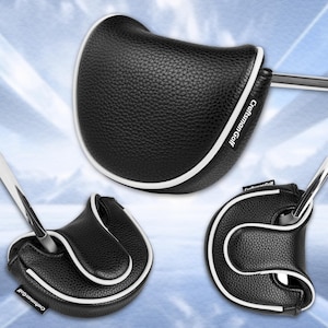 Może przedstawiać: Czarna osłona gł&oacute;wki puttera golfowego z białym wykończeniem. Osłona ma teksturowany wygląd, a tekst "Craftsman Golf" jest widoczny. Osłona ma chronić gł&oacute;wkę puttera.