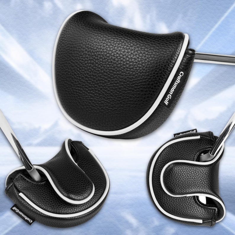 Może przedstawiać: Czarna osłona gł&oacute;wki puttera golfowego z białym wykończeniem. Osłona ma teksturowany wygląd, a tekst "Craftsman Golf" jest widoczny. Osłona ma chronić gł&oacute;wkę puttera.