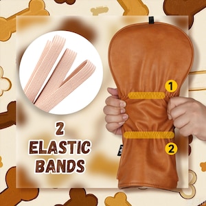 Puede incluir: Una funda marr&oacute;n para la cabeza del palo de golf con dos bandas el&aacute;sticas amarillas. La imagen tambi&eacute;n muestra dos bandas el&aacute;sticas y el texto "2 Elastic Bands".