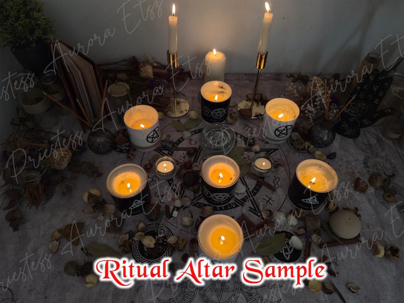 May include: A ritual altar arrangement with lit candles, including tall taper candles and votives in glass holders. The altar features a pentagram design, dried botanicals, and the text "Ritual Altar Sample".