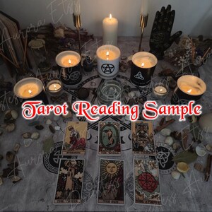 May include: A mystical scene with lit candles, tarot cards, and decorative items arranged on a patterned cloth. The text "Tarot Reading Sample" is visible. The arrangement suggests a tarot reading, creating a spiritual and atmospheric setting.