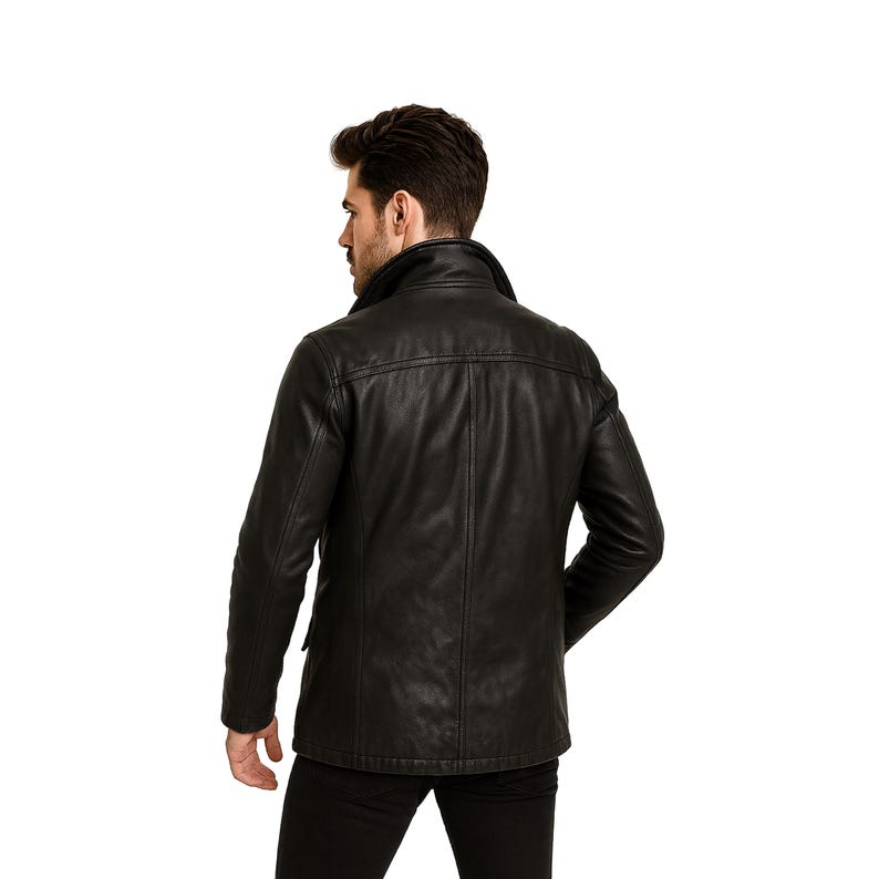 May include: A black leather jacket with a classic design. The jacket features a collared neckline, long sleeves, and a button-down front. The jacket has two front pockets and a tailored fit. The model is wearing black pants.