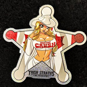 May include: A star-shaped sticker featuring a cartoon woman in a white cowboy hat and outfit. The text "YOUR FIRST CRUSH" is on the woman's top. The sticker has a silver border and the text "TRISH STRATUS" at the bottom.