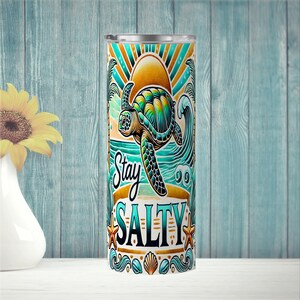Ride the waves and stay salty with this tropical beach tumbler wrap! Featuring a vibrant sea turtle, golden sunset, palm trees, ocean waves, seashells, and starfish. Designed for 20 oz skinny tumblers, this high-quality PNG brings bold coastal vibes to your sublimation projects.