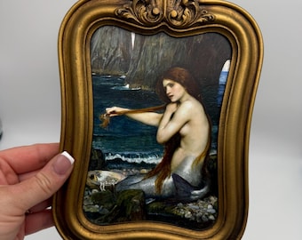 Gold ornate vintage frame with mermaid print