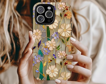 May include: A floral phone case featuring a stained-glass design. The case showcases a pattern of cream, peach, and purple flowers with green leaves, set against a light gray background. The case has a glossy finish and a camera cutout.
